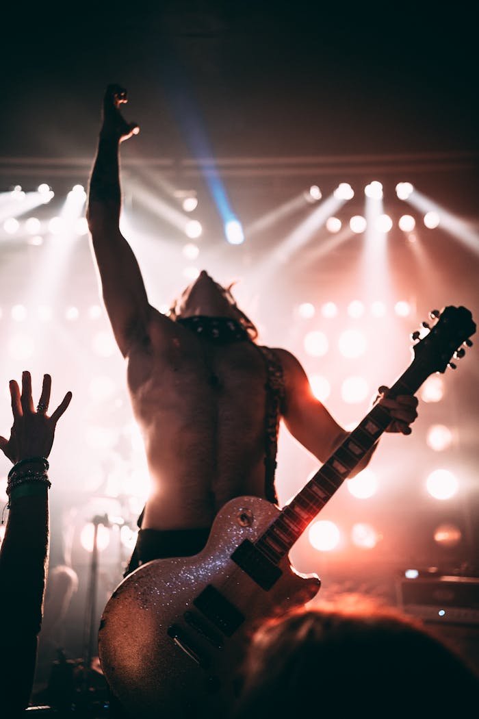 creative-03 Dynamic stage performance of a guitarist during a live rock concert.